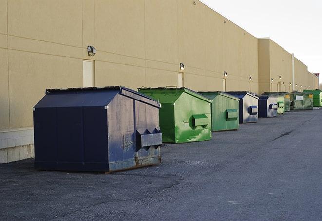 metal waste containers sit at a busy construction site in Benbrook TX